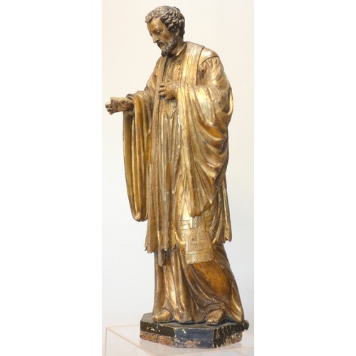 244 - A continental sculpted and gilt painted limewood model of a saint, in the 16th century style, 101cm.