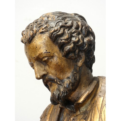 244 - A continental sculpted and gilt painted limewood model of a saint, in the 16th century style, 101cm.