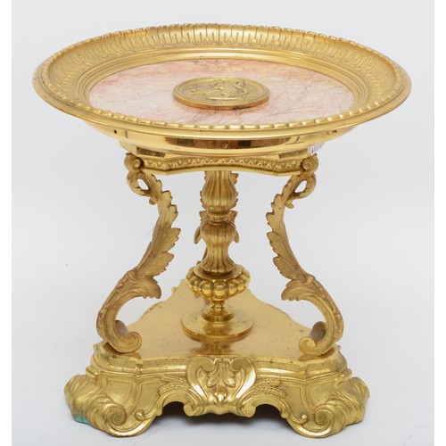 246 - A French late 19th century gilt bronze and marble table centrepiece, with central medallion, raised ... 