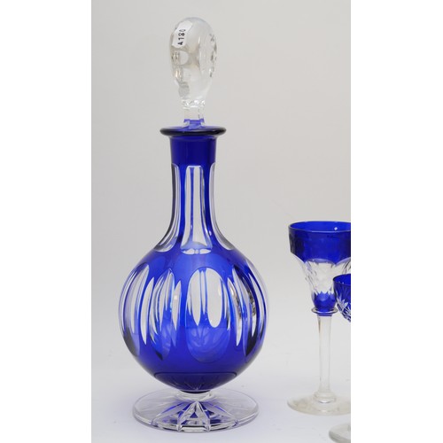 255 - A 20th century Bohemian blue glass decanter, together with a set of four matching sherry glasses and... 