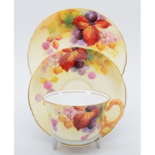 262 - A Royal Worcester trio, to include cup, saucer and side plate, painted fruit, all signed by artist, ... 