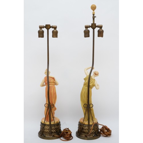 265 - A pair of Royal Worcester gilt and blush ivory figures of Classical Maidens table lamps,  modelled b... 