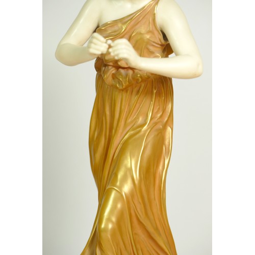 266 - A pair of Royal Worcester gilt and blush ivory figures of Classical Maidens, modelled by James Hadle... 