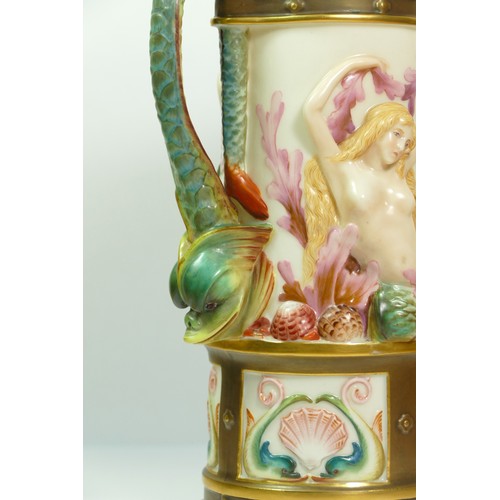 268 - A Royal Worcester blush ivory pitcher with Bacchus mask spout the body with Venus and mermaids, sea ... 