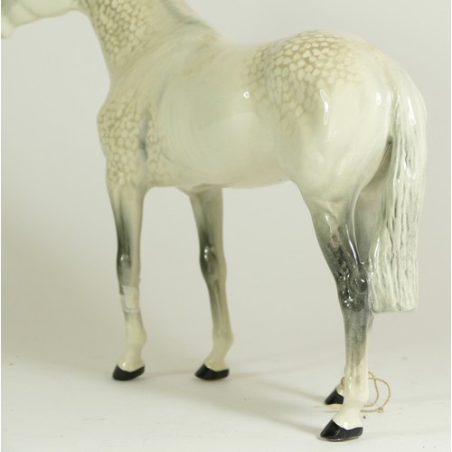 311 - A group of Beswick mare models, comprising of a Palomino, a brown bay, two shire horses and a grey I... 