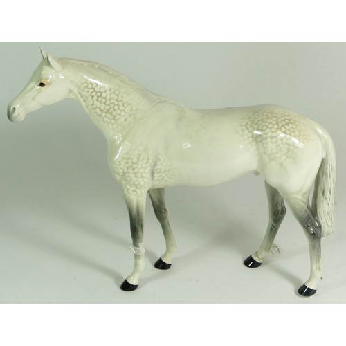 311 - A group of Beswick mare models, comprising of a Palomino, a brown bay, two shire horses and a grey I... 