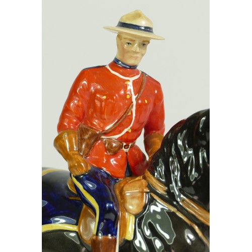 312 - A Beswick model of a policeman on a horse, H21cm, together with two Beswick Shetland ponies. (3)