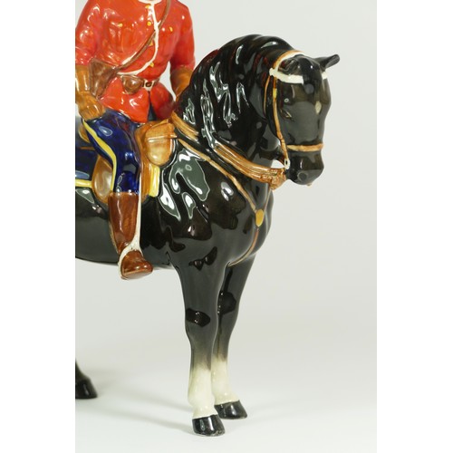 312 - A Beswick model of a policeman on a horse, H21cm, together with two Beswick Shetland ponies. (3)