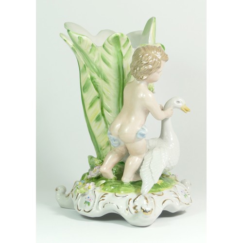 277 - A late 19th century German porcelain vase, depicting a boy standing next to a flower bud shaped vess... 