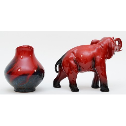 292 - A Royal Doulton ceramic figure in the form of a elephant, Flambe, 19 x 13 x 7cm, together with a Roy... 