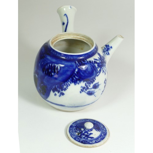 320 - A Japanese Meiji blue and white porcelain teapot, painted with floral sprigs, 18 x 18 cm.