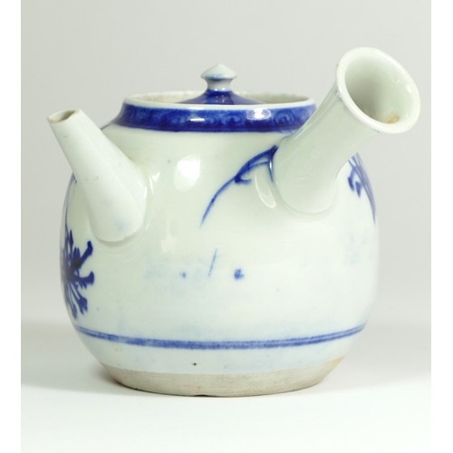 320 - A Japanese Meiji blue and white porcelain teapot, painted with floral sprigs, 18 x 18 cm.