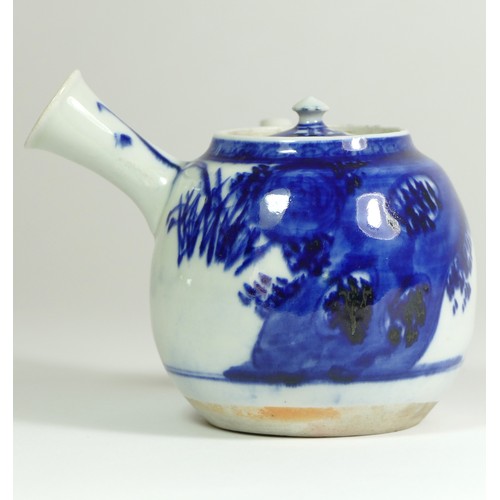 320 - A Japanese Meiji blue and white porcelain teapot, painted with floral sprigs, 18 x 18 cm.