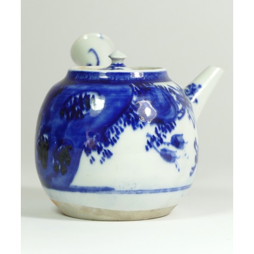 320 - A Japanese Meiji blue and white porcelain teapot, painted with floral sprigs, 18 x 18 cm.