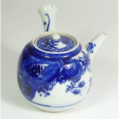 320 - A Japanese Meiji blue and white porcelain teapot, painted with floral sprigs, 18 x 18 cm.