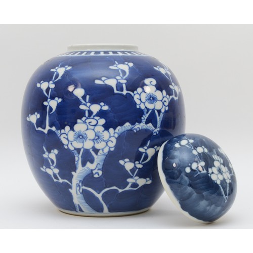 325 - A Chinese lidded ginger jar, hand decorated in blue & white with prunus foliage, circa late 19th cen... 