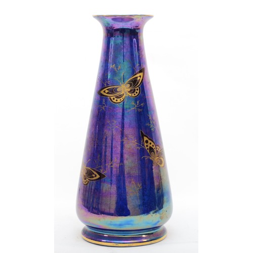 291 - A Crown Devon Fielding lustre vase, of cylindrical form with butterfly decoration, 31cm tall.