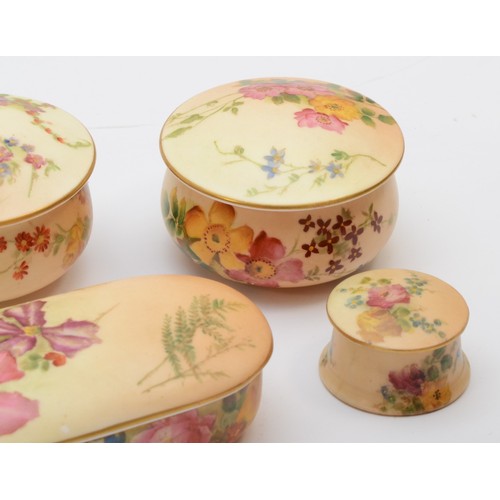 273 - A collection of Royal Worcester lidded pin pots of various sizes, hand painted floral decoration on ... 