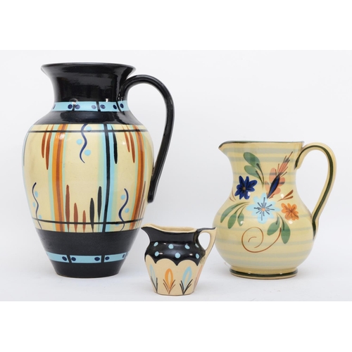 295 - Three mid 20th century graduated Hartrox pottery jugs by Hartley of Castleford, the largest 27cm tal... 