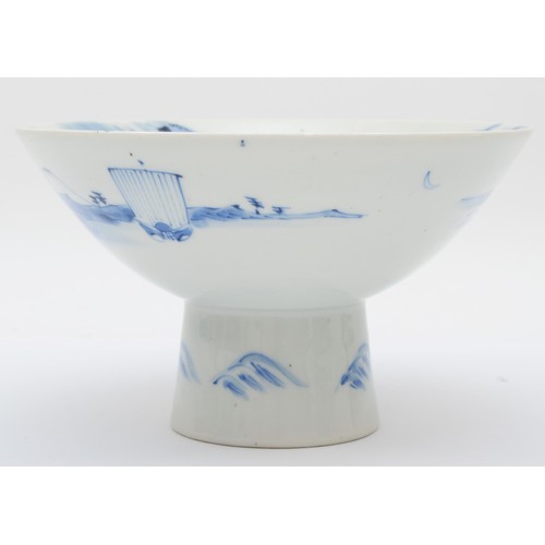 321 - A Japanese blue and white porcelain stem cup, early 20th century, painted in overglaze enamels to sh... 