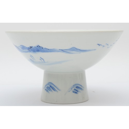 321 - A Japanese blue and white porcelain stem cup, early 20th century, painted in overglaze enamels to sh... 