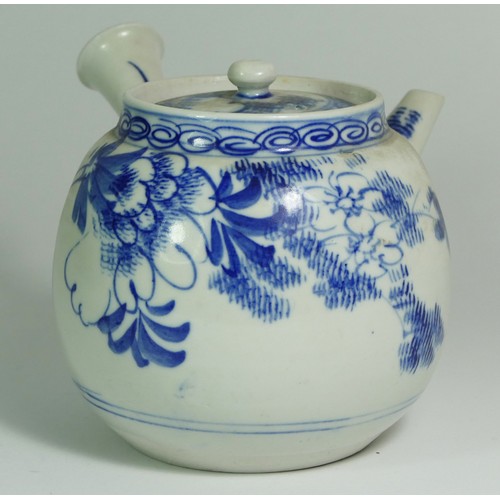 322 - A Japanese Meiji period porcelain teapot, early 20th century, decorated with foliage, 12cm tall.