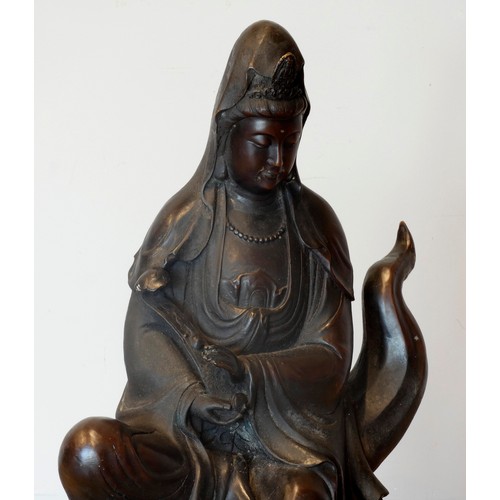 327 - A Chinese large bronze of Guanyin or Kuan Yin, seated on waves, six character mark to the back, 75cm