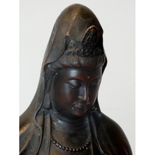 327 - A Chinese large bronze of Guanyin or Kuan Yin, seated on waves, six character mark to the back, 75cm