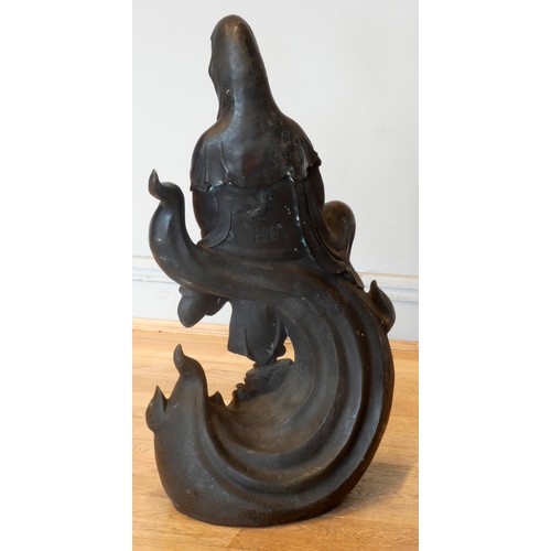 327 - A Chinese large bronze of Guanyin or Kuan Yin, seated on waves, six character mark to the back, 75cm