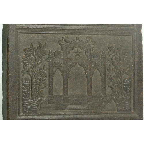 334 - A Chinese tea brick, early 20th century,  23.5 x 18.5cm, this compressed 'cake' of tea was often use... 