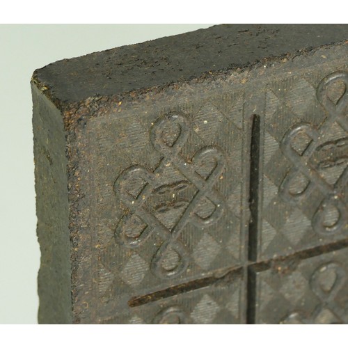 334 - A Chinese tea brick, early 20th century,  23.5 x 18.5cm, this compressed 'cake' of tea was often use... 