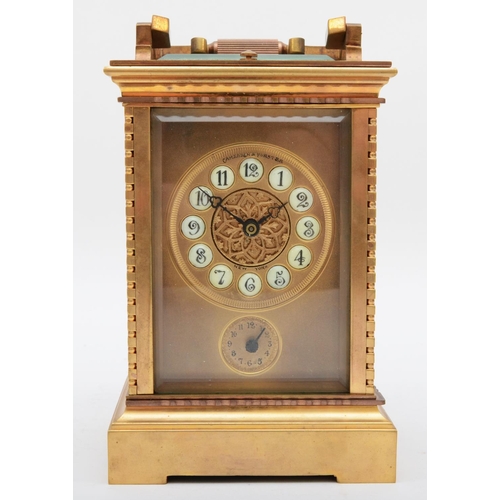 351 - A 20th century polished gilt brass striking and repeating carriage clock, having push button repeat ... 