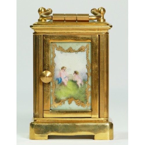 354 - A brass and porcelain panel small carriage timepiece, decorated with cherubs, 6.5cm