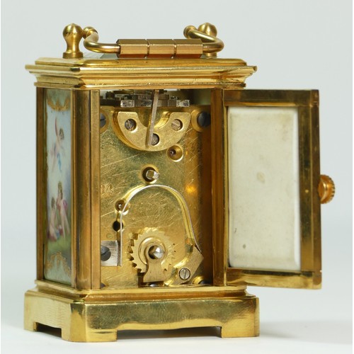 354 - A brass and porcelain panel small carriage timepiece, decorated with cherubs, 6.5cm