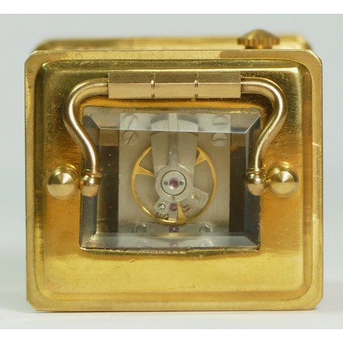 354 - A brass and porcelain panel small carriage timepiece, decorated with cherubs, 6.5cm