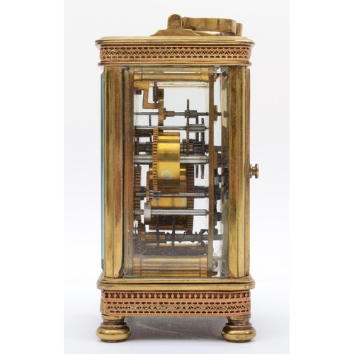 356 - An early 20th century brass alarm carriage clock, with 8 day movement striking on bell. 13cm tall, w... 