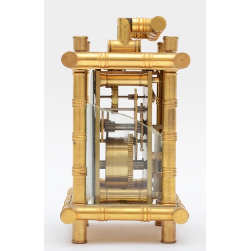 357 - A brass carriage clock, retailed by Elliott & Son London, with stylised bamboo gilt frame, housing a... 