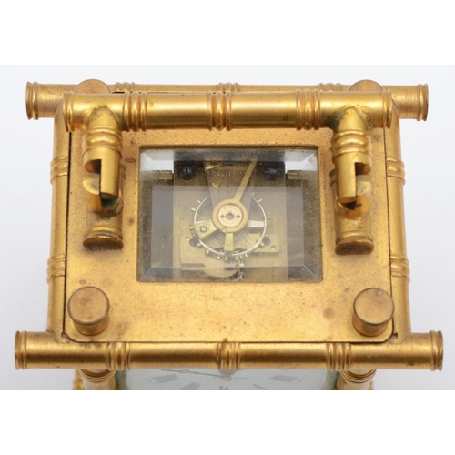 357 - A brass carriage clock, retailed by Elliott & Son London, with stylised bamboo gilt frame, housing a... 