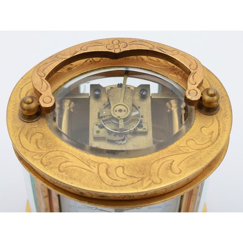 362 - An Elliott & Son eight day carriage clock, chased gilt case of oval form. 9cm tall.