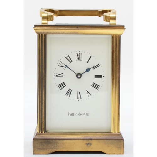 364 - A mid 20th century brass carriage clock, retailed by Mappin & Webb, having enamelled dial with Roman... 