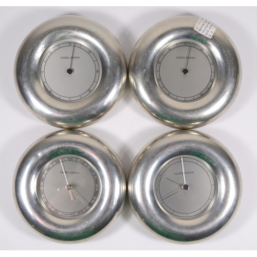 377 - Georg Jensen, a set of four weather stations, of circular form, pewter framed, 13cm diameter (4)