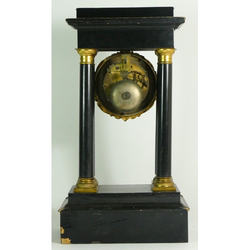 378 - A French Empire style ebony four pillar mantel clock, with eight day drum movement, striking on a si... 