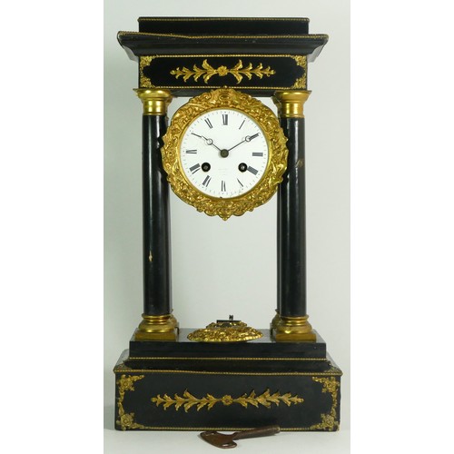 378 - A French Empire style ebony four pillar mantel clock, with eight day drum movement, striking on a si... 