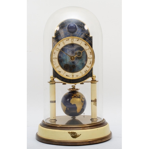 382 - A 1950s German Torsion 400-day anniversary clock, having moon phase and a painted globe of the world... 