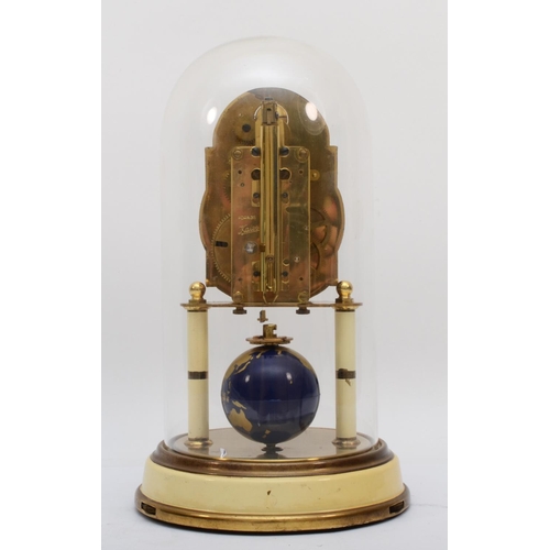 382 - A 1950s German Torsion 400-day anniversary clock, having moon phase and a painted globe of the world... 