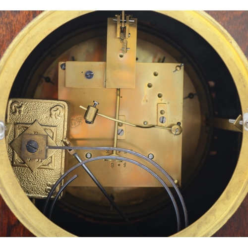 383 - An Edwardian mahogany cased mantel clock, the circular enamel dial with blued steel hands and a visi... 