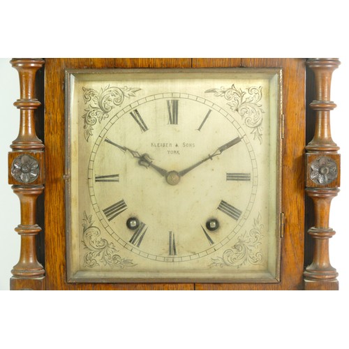 386 - An Edwardian oak bracket clock, the case with open fretwork gallery, turned columns and finials with... 