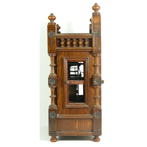 386 - An Edwardian oak bracket clock, the case with open fretwork gallery, turned columns and finials with... 