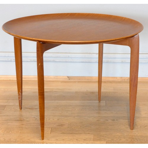 578 - A Fritz Hansen Danish teak folding side table, circa 1960-1969, model 0763.
60cm diameter.