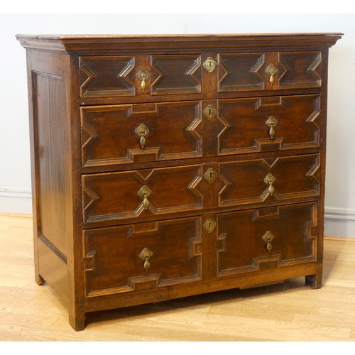 533 - A William III oak chest of drawers, having two short drawers over three graduated long drawers, moul... 